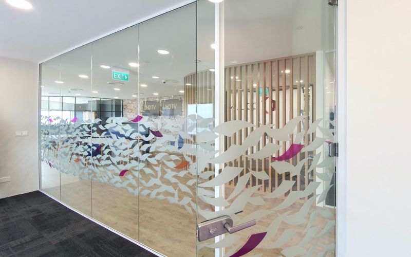 Showcasing Unique Decal on Glass Partitions – Frameless Glass Door