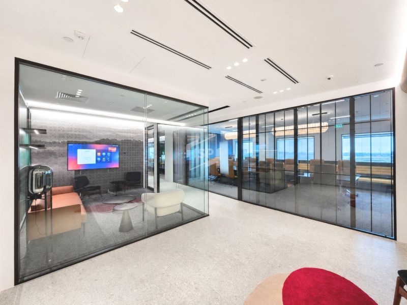 Glass Meeting Rooms Along the Office Corridor