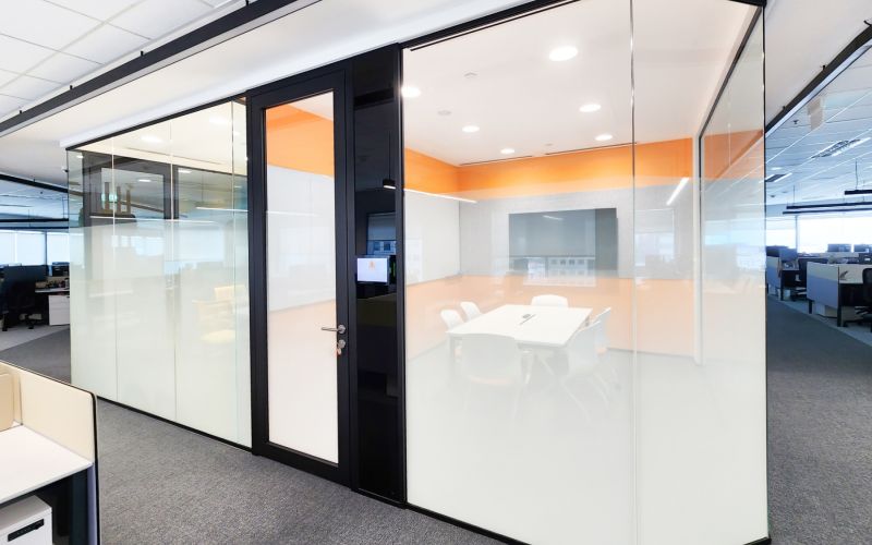 Office Meeting Room with Segmented Glass Design and Tech Panel