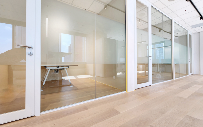 Minimalistic Workspace With White Single Glazed Partitions