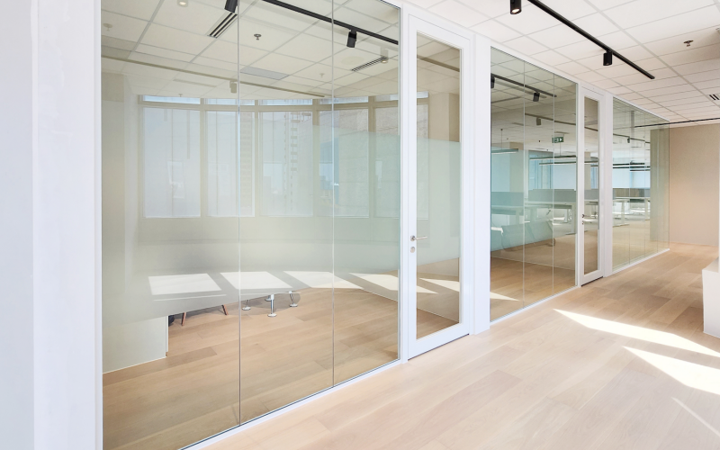 Minimalistic Workspace With White Single Glazed Partitions