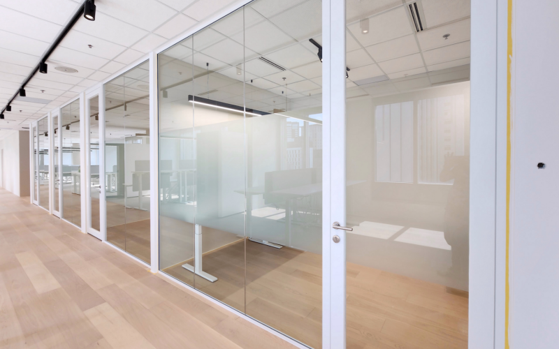 Minimalistic Workspace With White Single Glazed Partitions