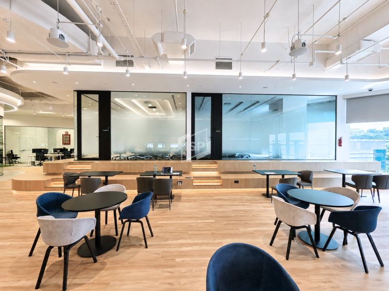 Acoustic glass partition system in office lounge