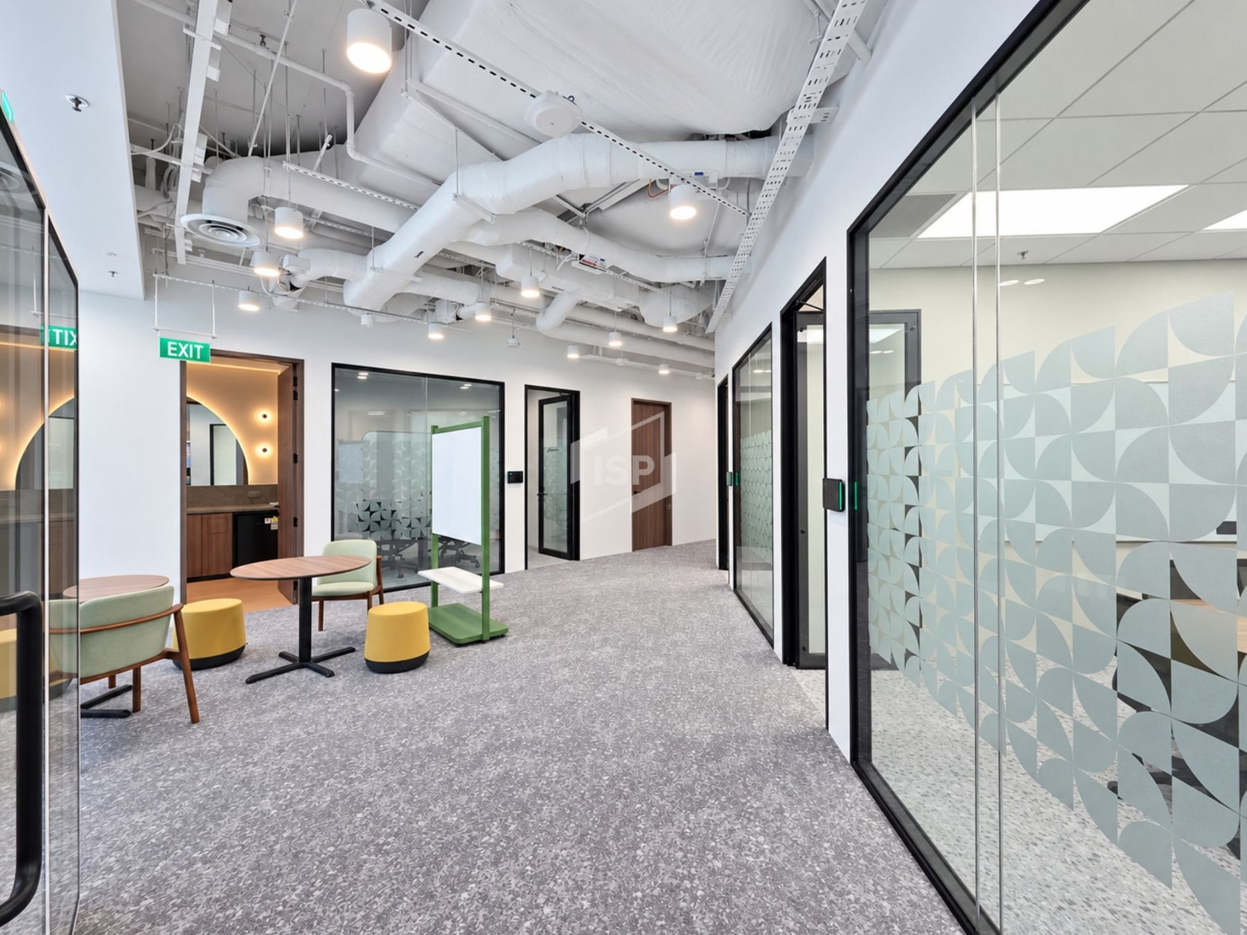 Glass Partitioned Meeting Rooms Along Office Corridor