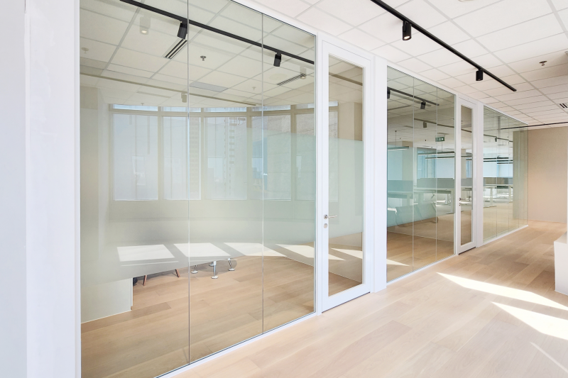 Minimalistic Workspace With White Single Glazed Partitions