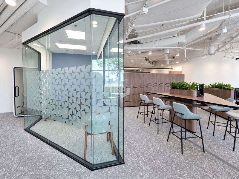 Angular Glass Meeting Room Beside Collaboration Area
