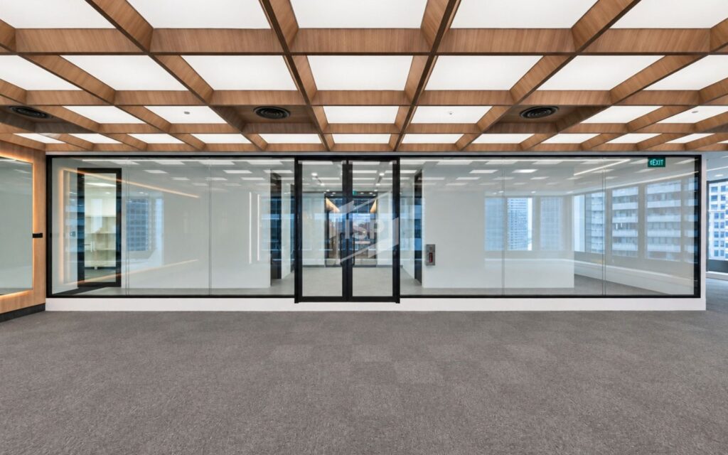 Full-height office glass enclosure with black-framed double doors and a timber feature ceiling