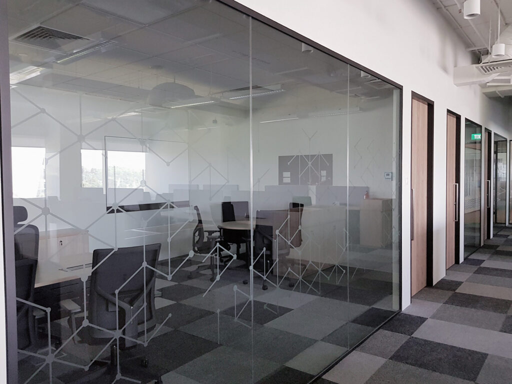 Glass Partition with Decorative Decal Manifestation