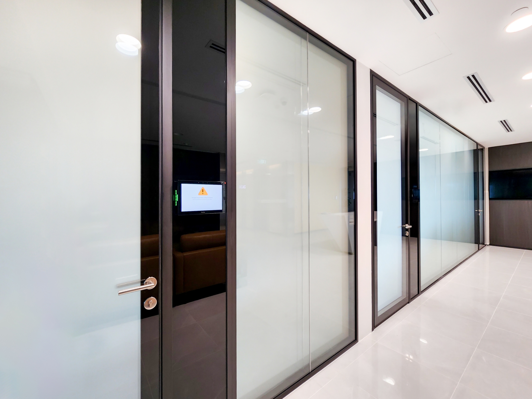 Meeting Room with Switchable Glass Design and Tech Panel